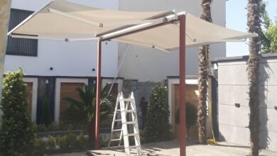 سایبان مغازه بازویی با پوشش روشن نمای نوساز